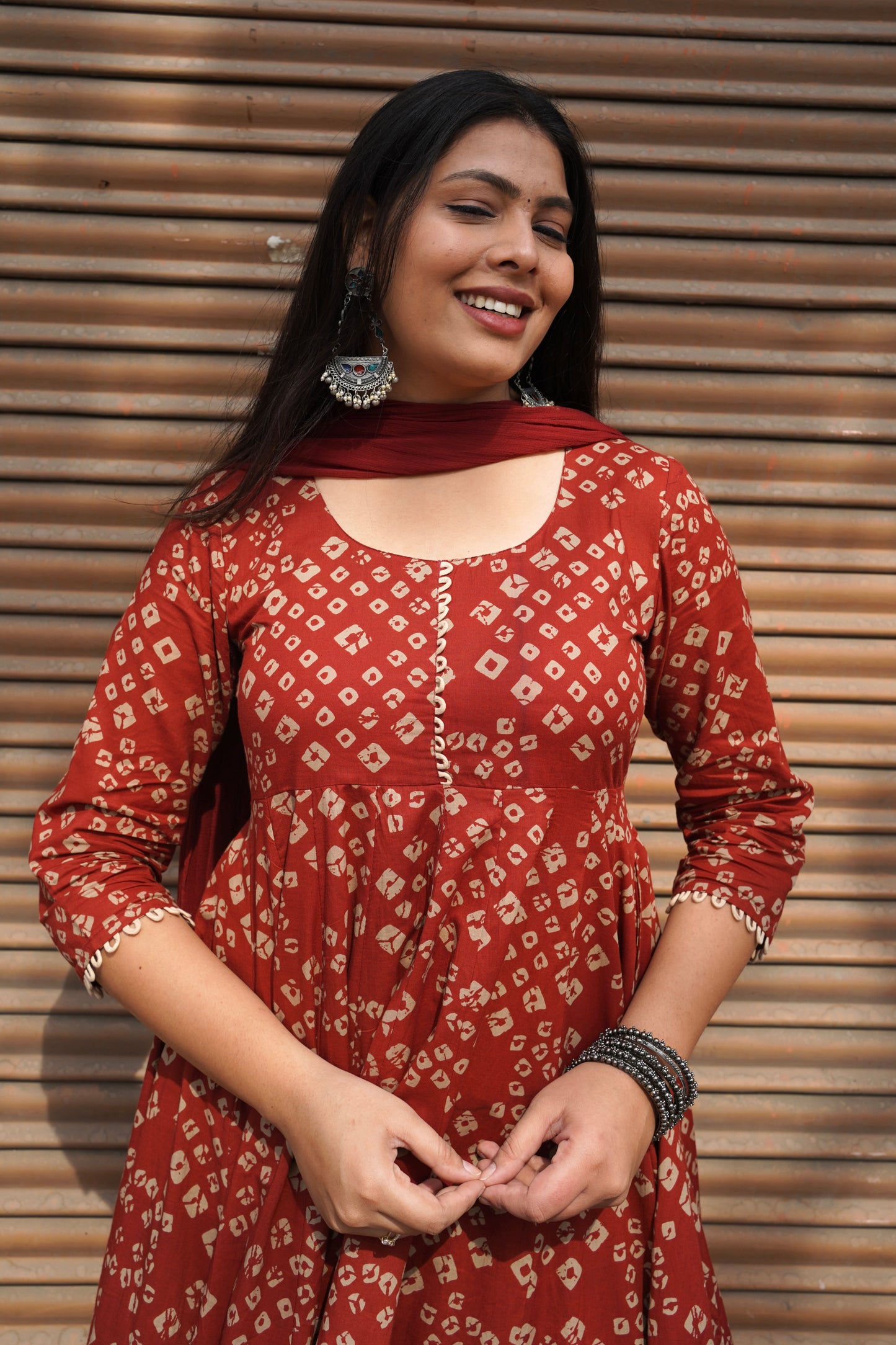 Red bandhej flared suit set